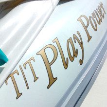A white boat with the word ti play power on it.