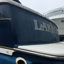 The back of a boat with the word lakeland on it.