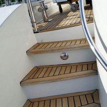 The steps leading up to the deck of a boat.