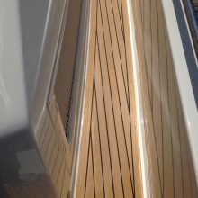 A close up of a wooden deck on a boat.