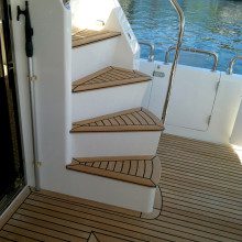A wooden staircase on a boat.